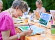 woman spends time painting in memory care activities